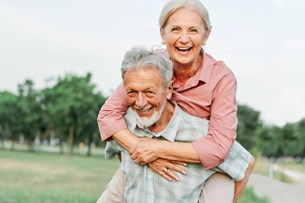 happy older couple with hearing aids happy older couple with hearing aids